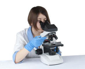 Female student using a microscope