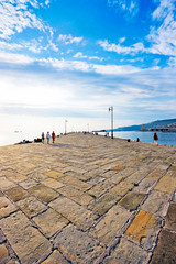 Beautiful Pier scene at sunset as seen in Trieste, Italy