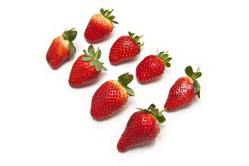 Strawberries isolated on a white studio background.
