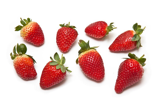 Strawberries isolated on a white studio background.