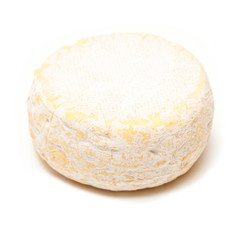 Petit Reblochon cheese isolated on a white studio background.