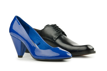 Male and female shoes on white