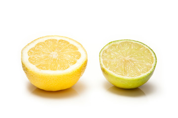 Lemon and Lime halved on a white background.