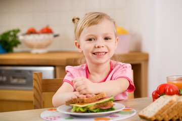 little girl with sandwich