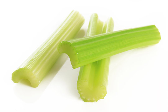 green celery sticks on white background