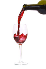 Red wine pouring down from a wine bottle