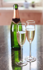 Two glasses of champagne and bottle