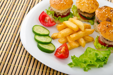 French fries and burgers in the plate