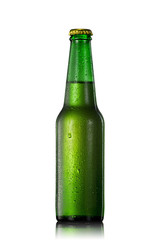 Beer bottle with water drops isolated on white