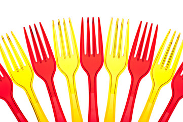 Disposable tableware. Set of colored plastic forks isolated