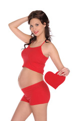 beautiful pregnant woman in red with heart