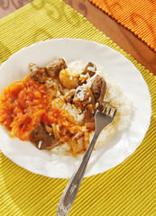 Rice with meat and stewed vegetables