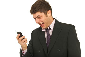 Naklejka premium Amazed by his phone mobile