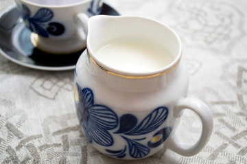 Obraz na płótnie Canvas milk jug on the table