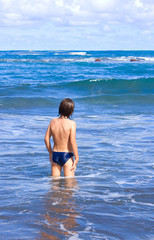 boy enjoying the sea in sunny day