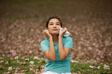 Fototapeta premium Pretty Thai woman rest exercise in the park .