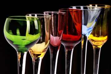 colorful glassware collection isolated on black