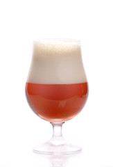 Frosty glass of light beer isolated on a white background.