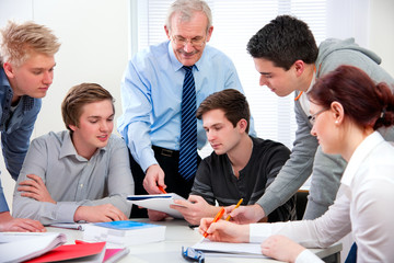 teacher with high school students