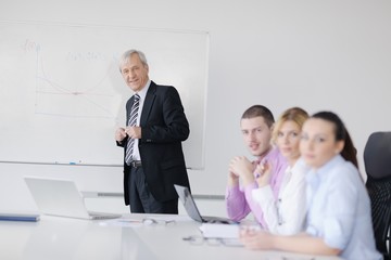 Senior business man giving a presentation