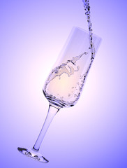 White Wine being poured in a wine glass