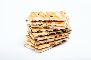 A stack of cookies with caramel filling on a white background.