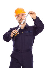 portrait of a young builder with the tools