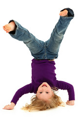 Beautiful Preschool Girl Child Laughing and Doing Hand Stand