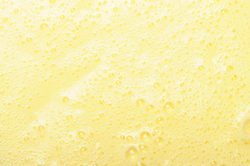 Texture of yellow custard with some small bubbles
