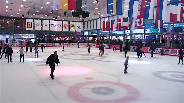 People skate on a skating rink
