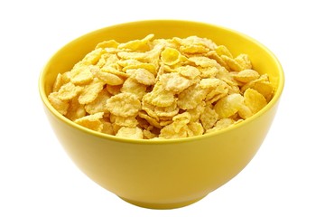 corn flakes in a bowl of yellow on a white background