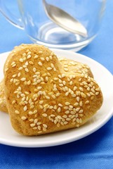 Cookies in the form of heart with sesame seeds on a plate