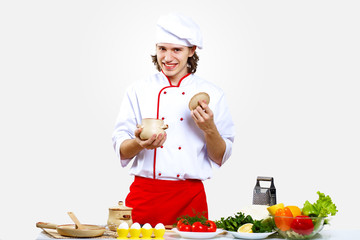 Portrait of a young cook in uniform