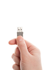 Hand holding grey USB cable