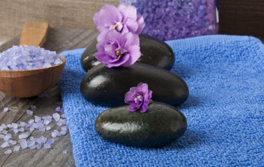 Fototapeta na wymiar stones with purple flower and lavender salt