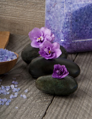 Obraz na płótnie Canvas stones with purple flower and lavender salt