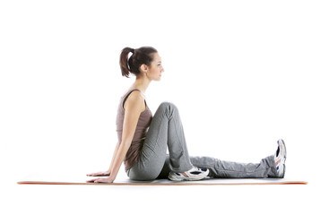 Fitness woman doing fitness exercise on mat . White background