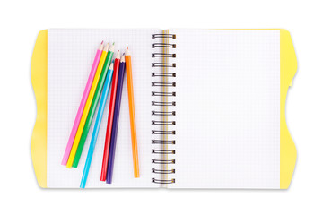 spiral notebook with colorful pencils