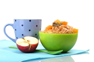 tasty cornflakes in green bowl, apple and glass of milk isolated