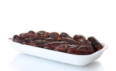 delicious dried dates in packaging isolated on white