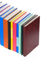 pile of new books isolated on white