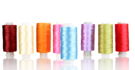 Many spools of thread isolated on white