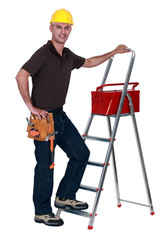 Worker with a toolbox and stepladder