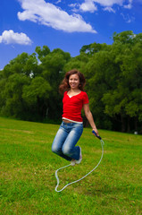 Young woman with skipping rope