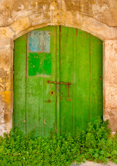 Green colored door in a building located in Limassol Cyprus