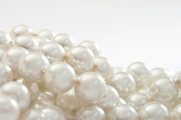 String of pearls on white