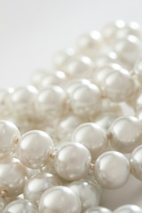 String of pearls on white