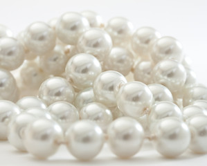 String of pearls on white.