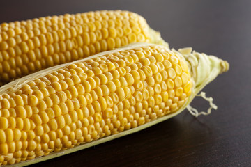 corn lying on a wooden table