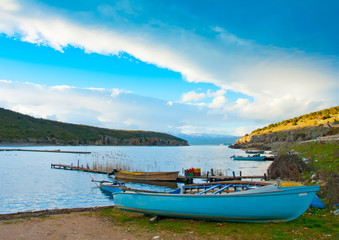 Naklejka na ściany i meble Old wooden fishing boat in the lake Prespa in northern Greece.